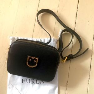 Black crossbody or waist bag.